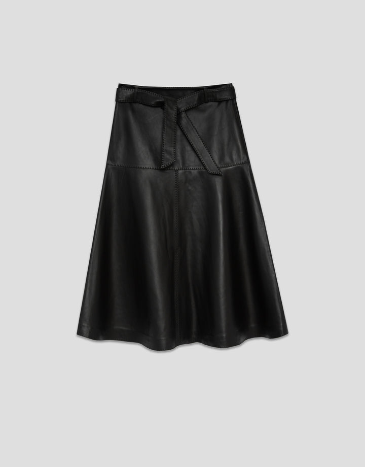 Black leather skirt on a light gray background