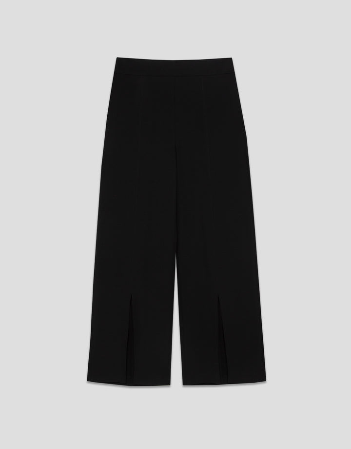 Black wide-leg pants on a light gray background