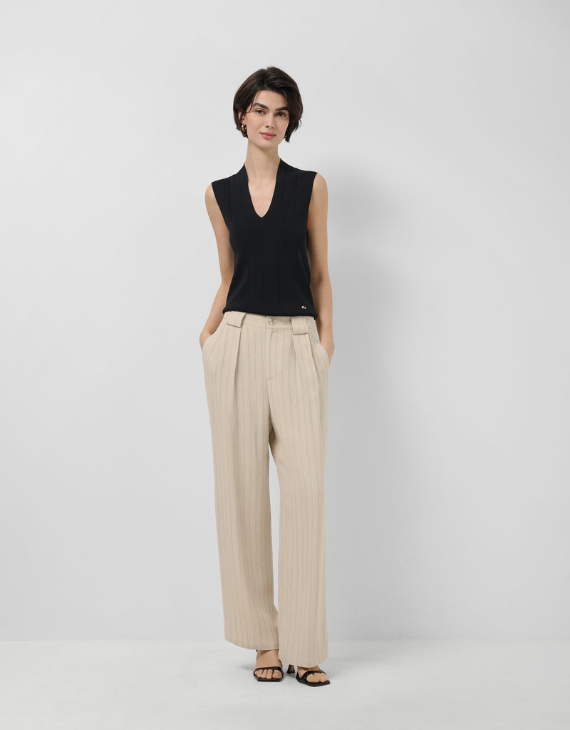 Beige pleated trousers with black pinstripes by Roberto Verino — tailored separates for a quiet luxury wardrobe Australia