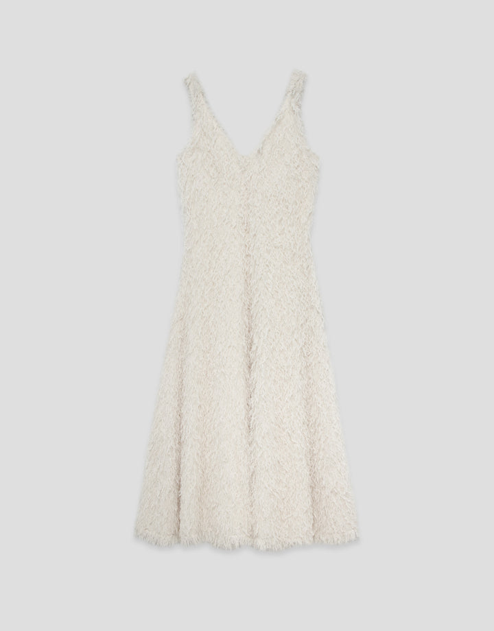 White textured dress on a light gray background