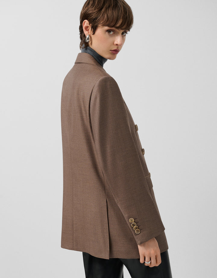 Woman wearing a brown coat on a white background