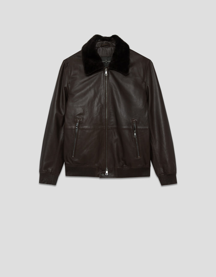 Dark brown leather jacket with fur collar on a light gray background