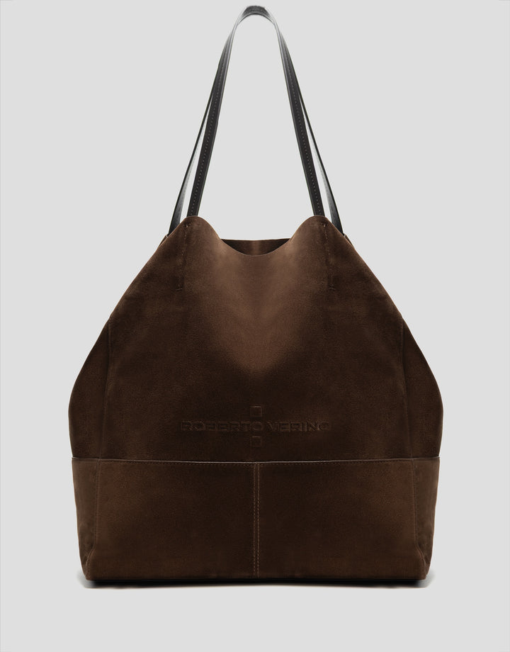 Brown leather tote bag with a visible brand logo on a light gray background