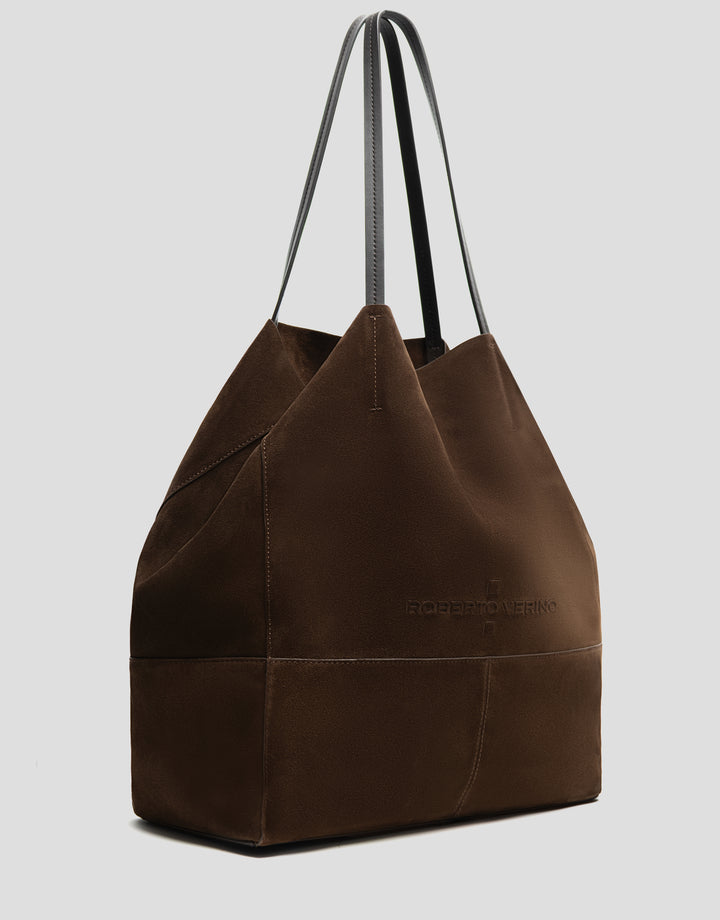 Brown leather tote bag with a visible brand logo on a light gray background