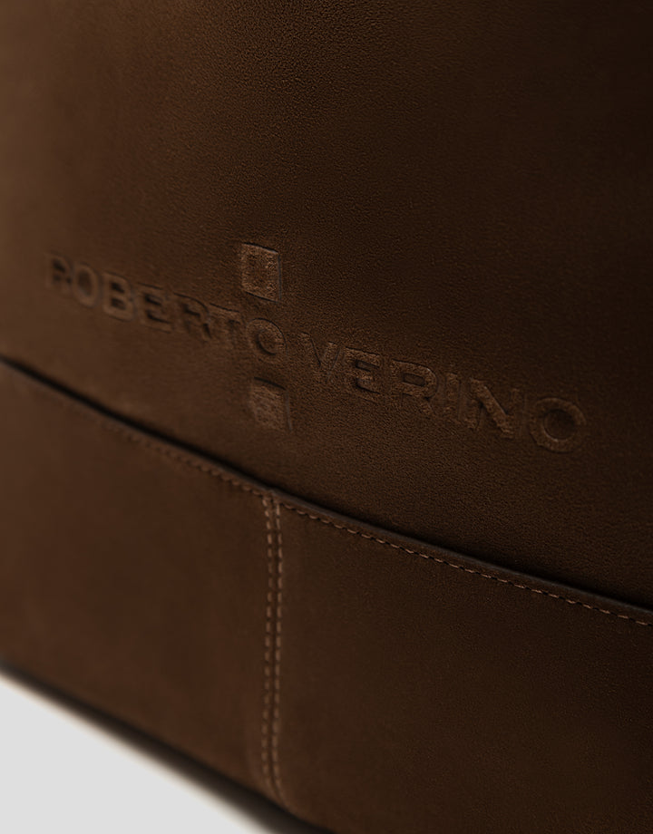 Close-up of a brown leather product with 'Roberto Verino' branding.
