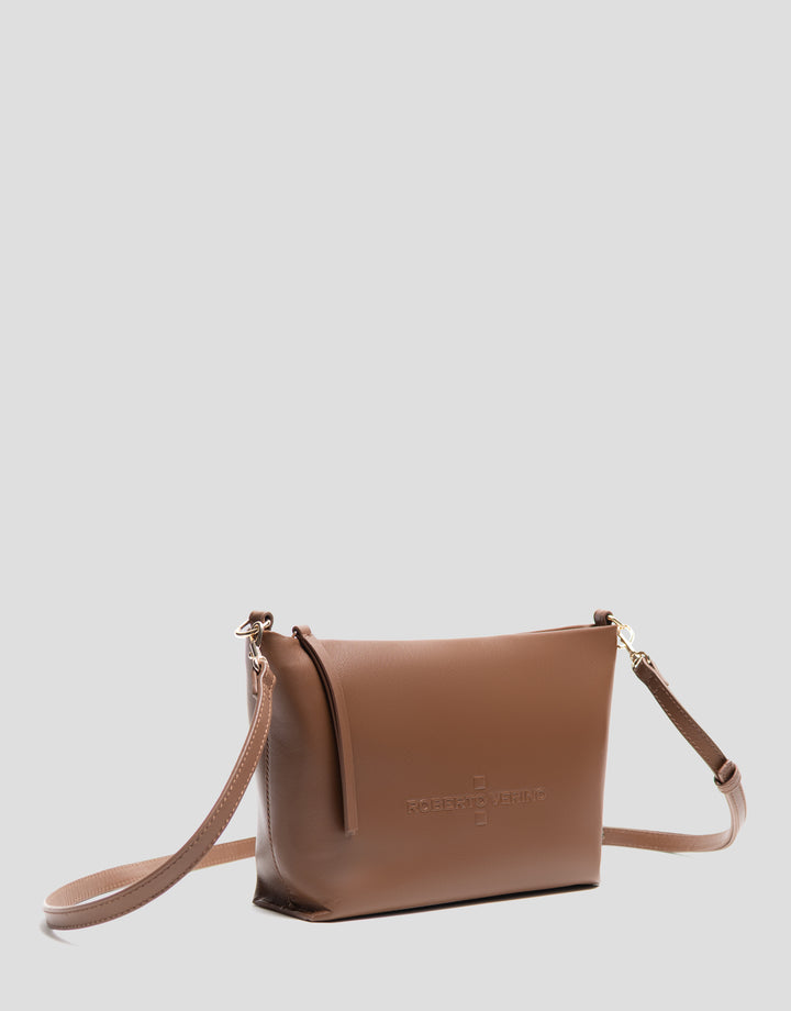 Brown leather handbag with a visible brand logo on a light gray background