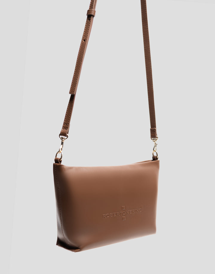 Brown leather handbag with a strap on a light gray background