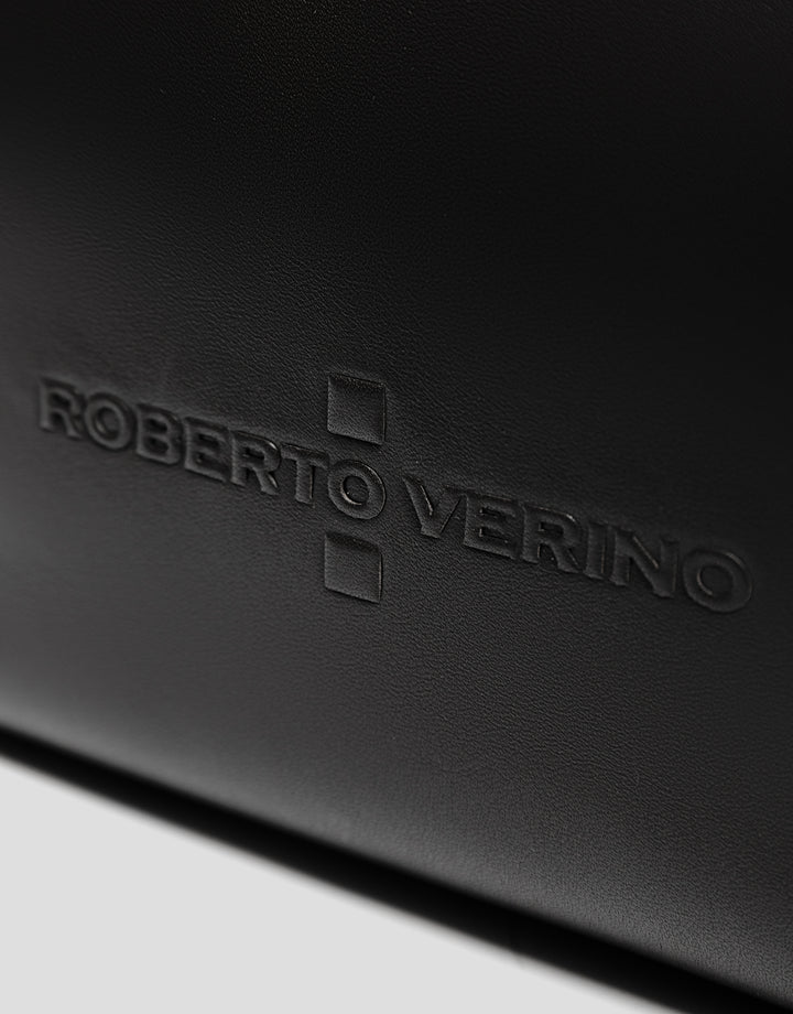Close-up of a black leather surface with 'Roberto Verino' branding.
