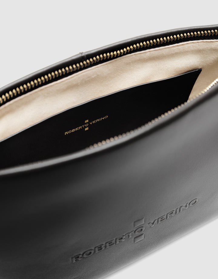 Close-up of a gray leather bag with 'Roberto Verino' branding on a light gray background