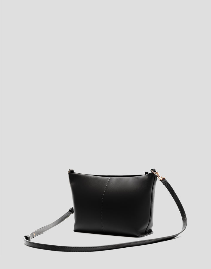 Black leather handbag on a light gray background