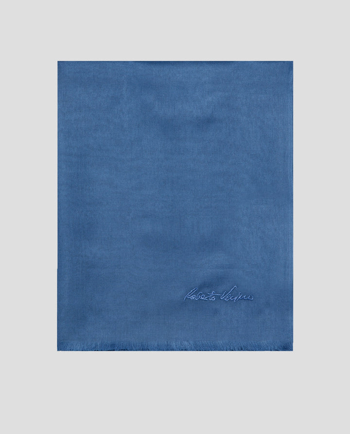 Blue fabric square with a brand logo on a light gray background