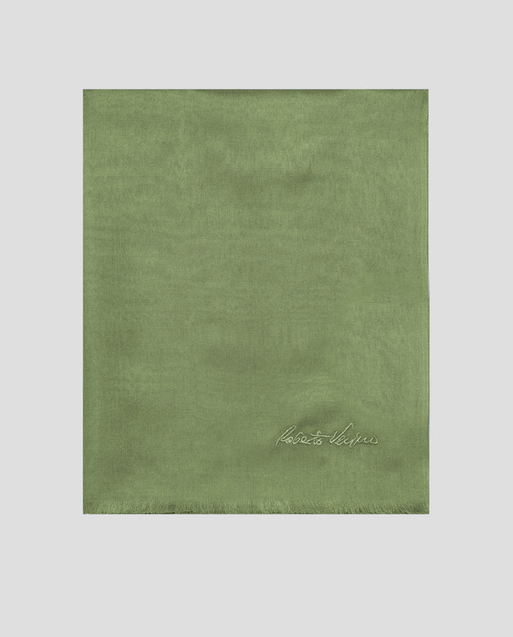 Green fabric with a brand logo on a light gray background