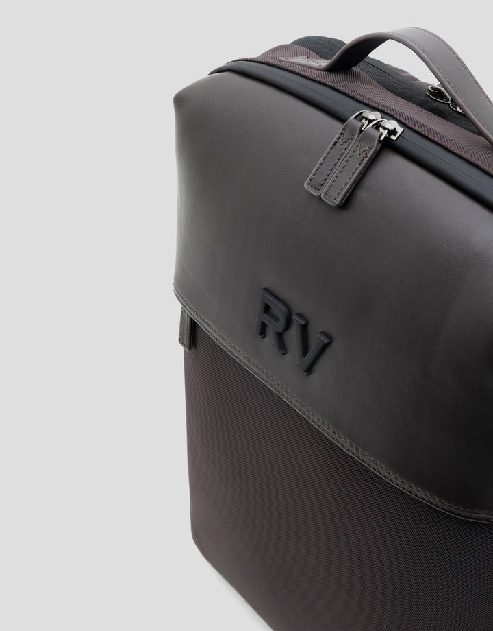 Black leather briefcase with 'RV' initials on a light gray background