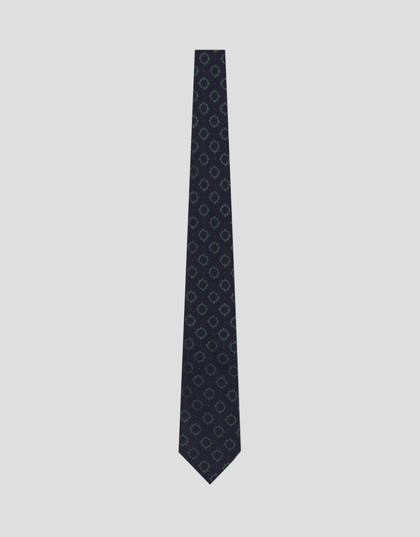 Black patterned tie on a light gray background
