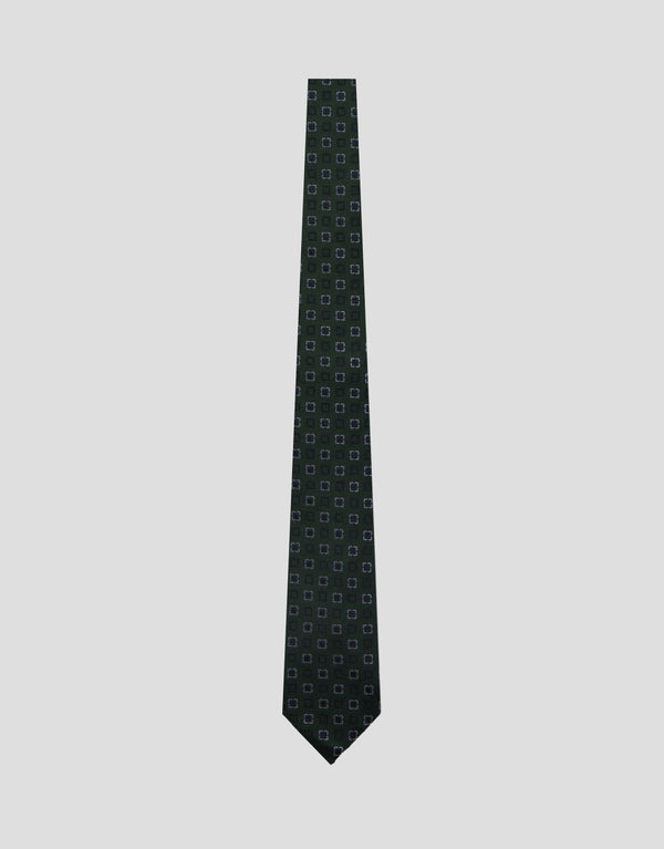 Black patterned tie on a light gray background
