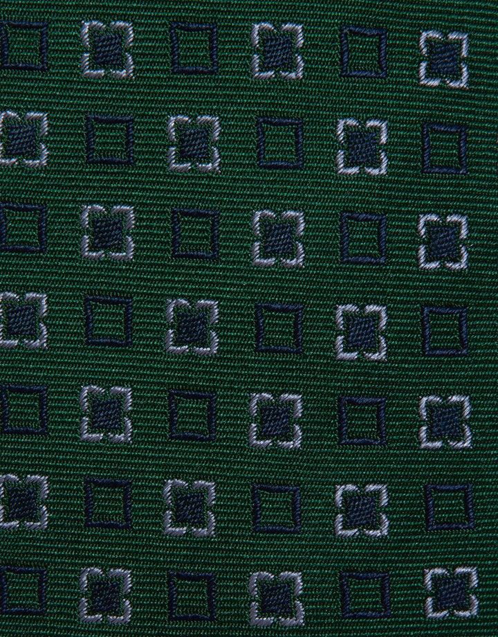 Close-up of a dark green fabric with a subtle pattern