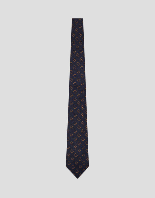 Black patterned tie on a light gray background