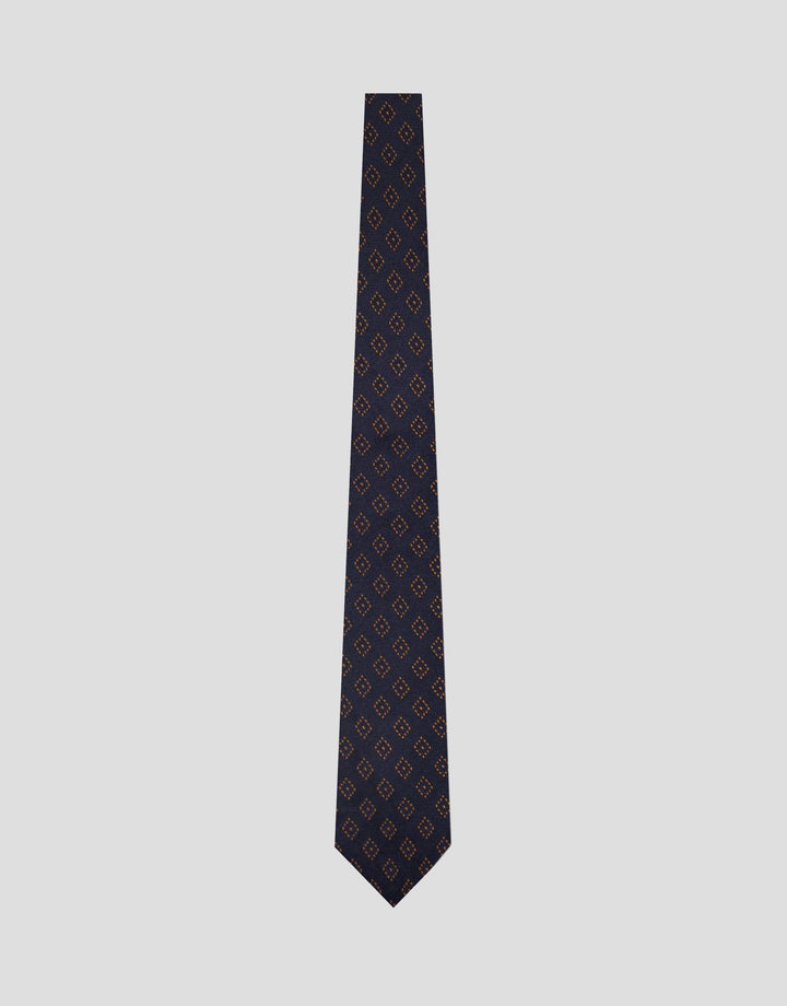 Black patterned tie on a light gray background