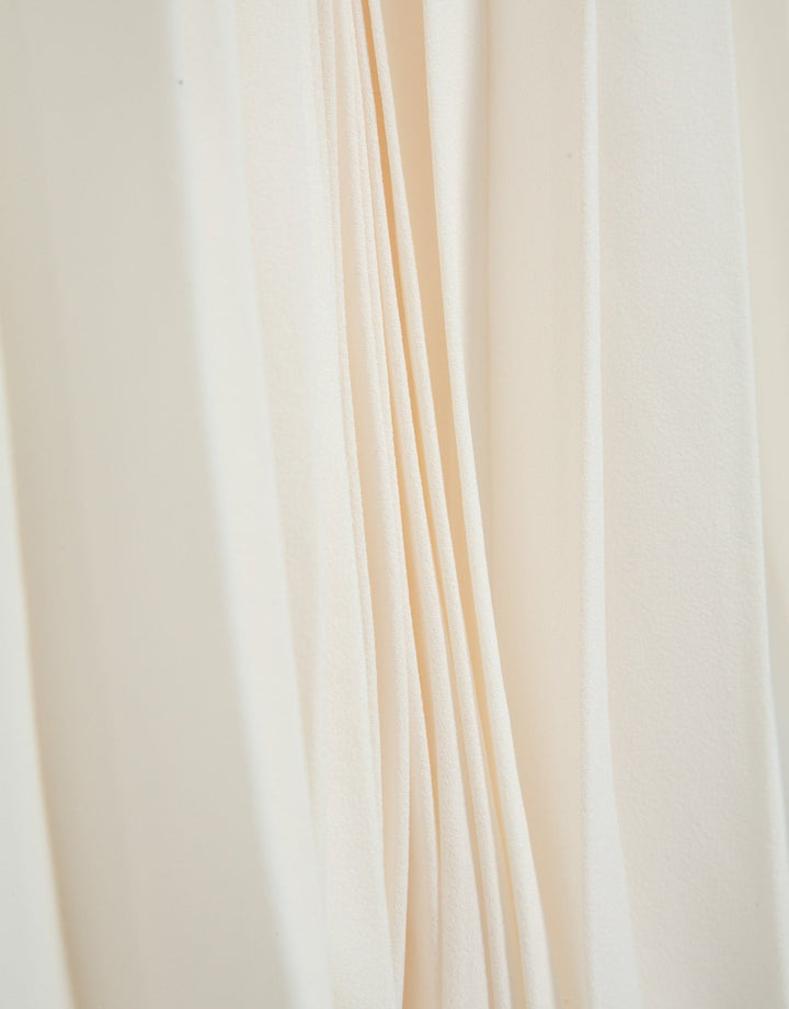 Skirts | Beige fluid fabric, midi pleated skirt by Spanish designer Roberto Verino