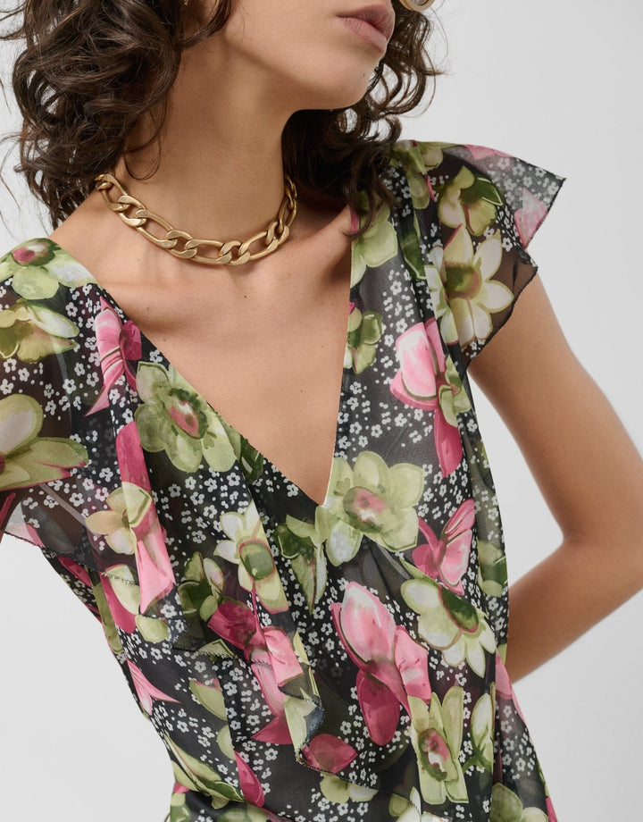 Dresses | Green georgette crepe dress with an asymmetric cut, frills and floral print by Spanish designer Roberto Verino