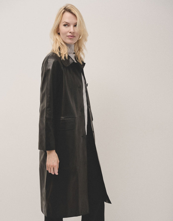 Outwear | Long black napa coat with ranglan sleeve by Spanish designer Roberto Verino
