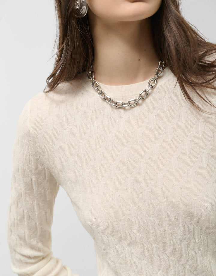 Knitwear | Long - sleeved wool sweater with raw eights by Spanish designer Roberto Verino